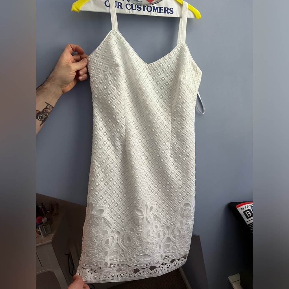 Romantic white cocktail dress.